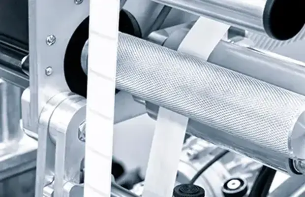 Laser scoring systems for integration in printing machines and systems that produce labels and stickers.